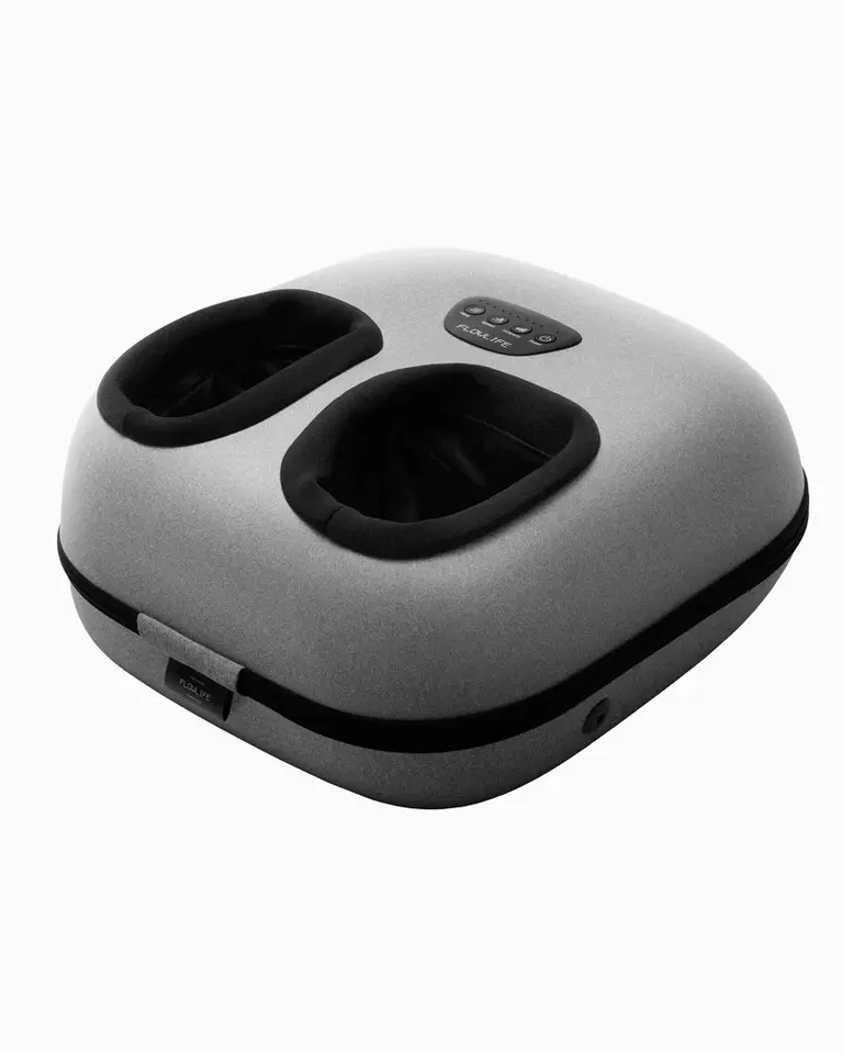 Angled studio view of the gray Flowfeet Heat foot massager, featuring air compression and integrated heat therapy.