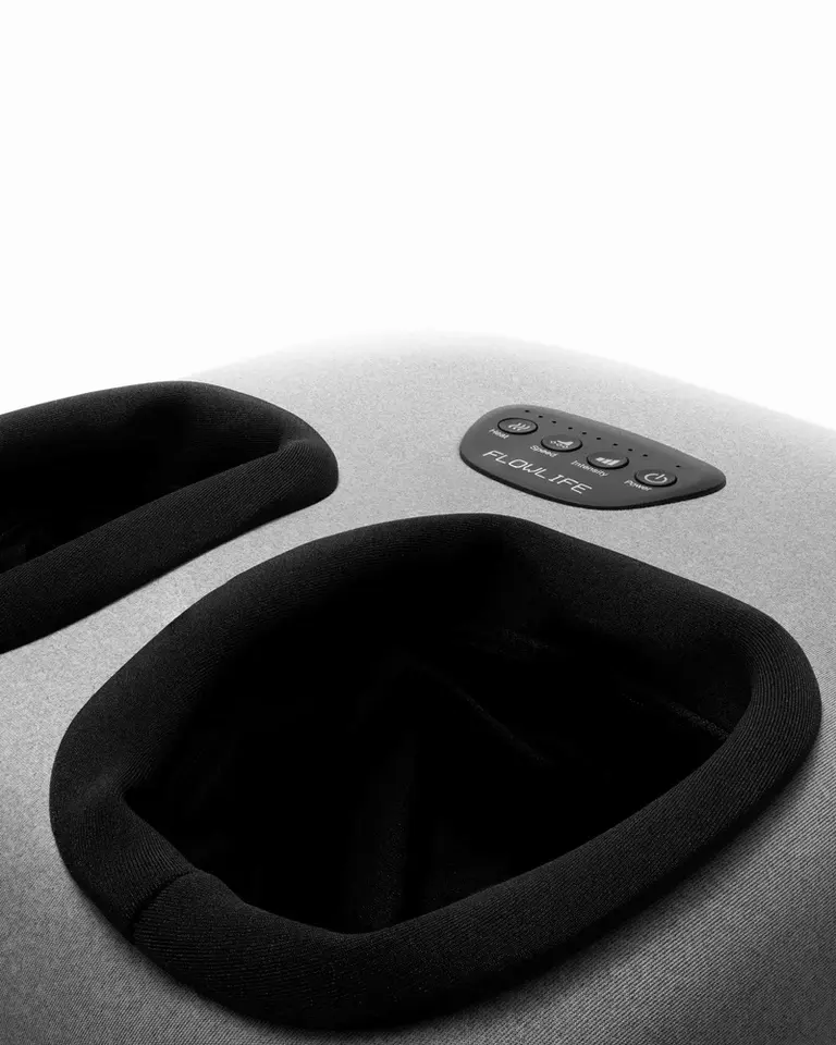 Flowfeet Heat foot massager featuring a grey fabric exterior, dual black foot openings, and an integrated control panel.