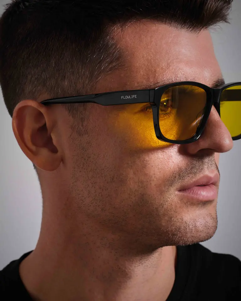 Close-up side profile of Álvaro Morata wearing the Flowglasses Day Sync 02 - Álvaro Edition with yellow-tinted lenses.
