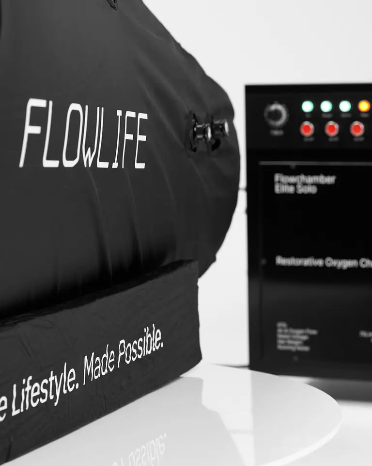 A close-up of the black Flowchamber Oxygen Elite 226 Soft-Shell showing the white Flowlife logo and control panel.