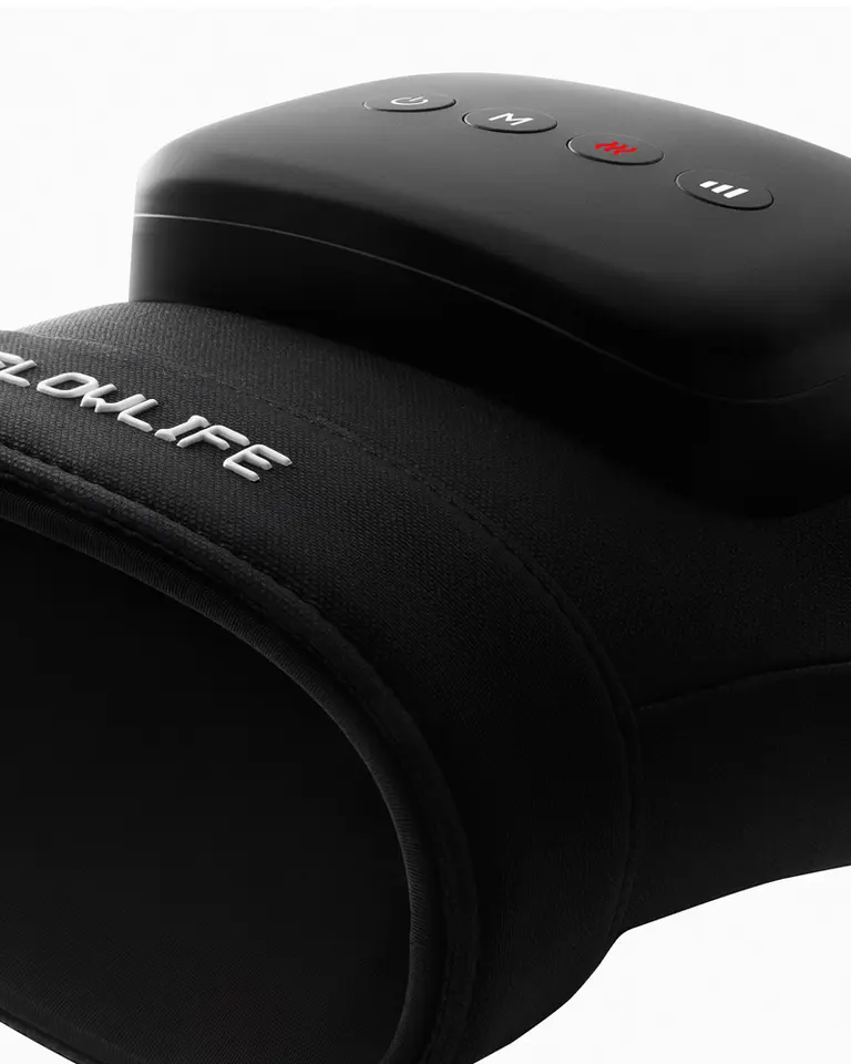 Angled close-up of the black Flowpression Hand massager showing the integrated control panel and heat therapy button.