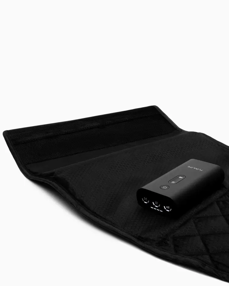 Flowpression Calf Duo unit with black honeycomb fabric, adjustable Velcro straps, and a cordless control unit.
