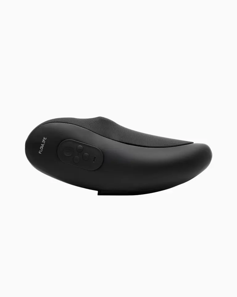 Side profile of the black Flowpillow Pro shiatsu massage pillow, featuring ergonomic power thumbs and control buttons.