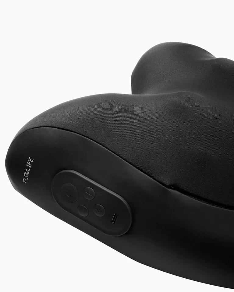 A close-up side view of the black Flowpillow Pro showing the integrated control panel buttons and USB-C port.