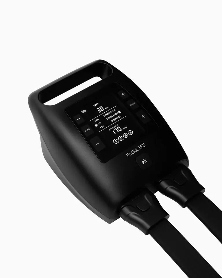 Flowpression Boots Pro+ digital control unit with a display for selecting compression modes and pressure intensity.