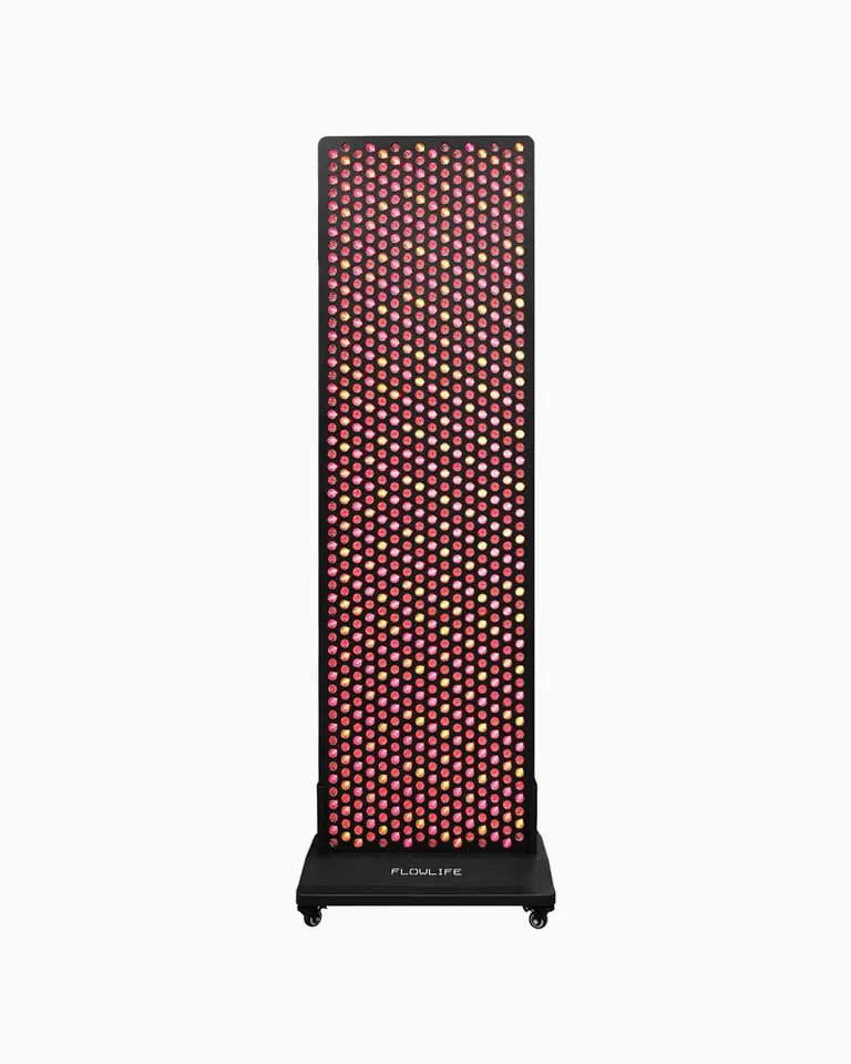 Flowlight 4300 Eight Waves red light therapy panel with illuminated LEDs and a wheeled stand for full-body recovery.