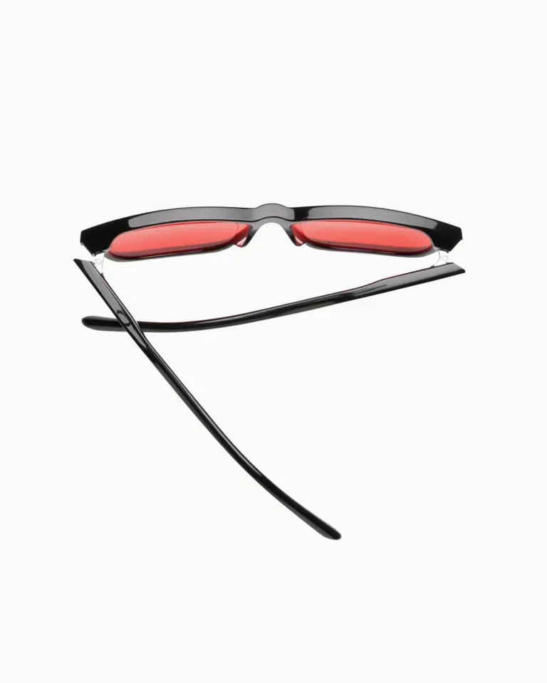 Flowglasses Night Sync 02 - Morata Edition with red lenses and a black frame, designed for evening light filtration.