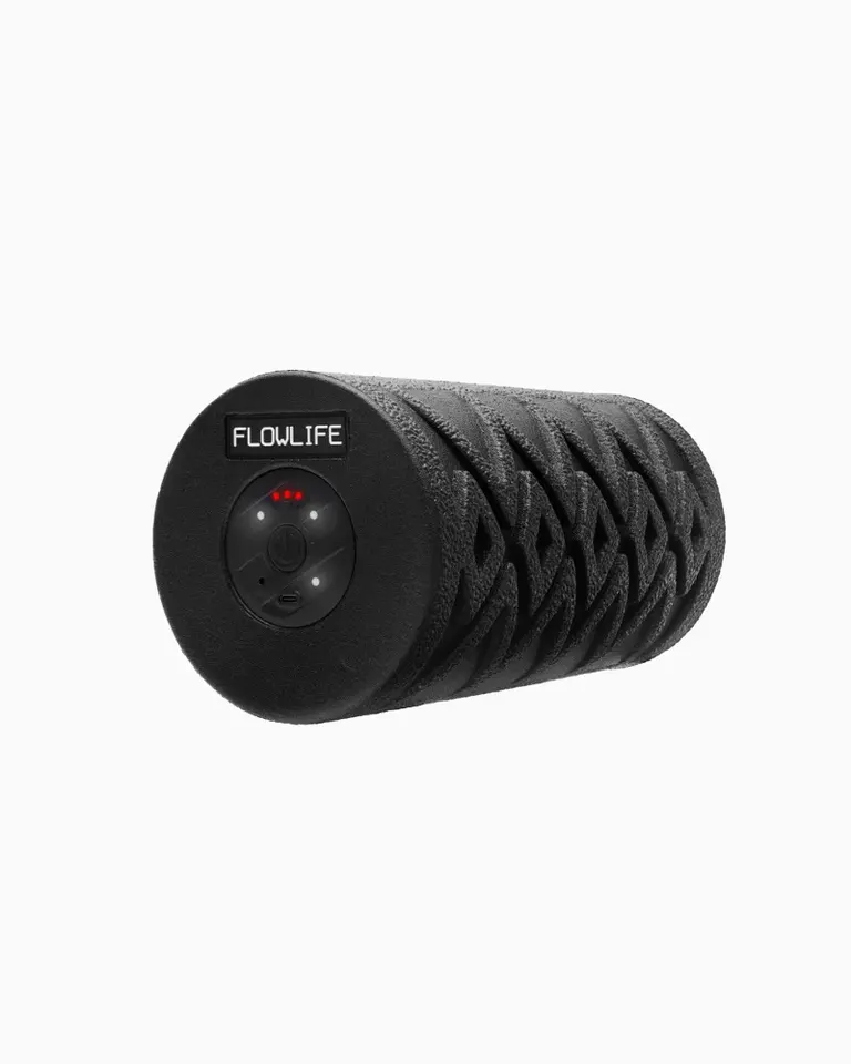 Black Flowroller Pro vibrating foam roller with a textured EPP foam surface and integrated control panel.