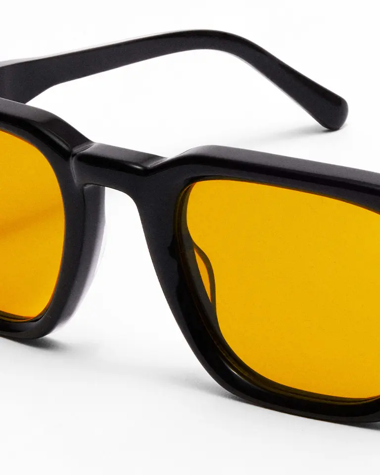 Flowglasses Day Sync 03 - Morata Edition featuring black acetate frames and amber lenses for daytime blue light filtering.