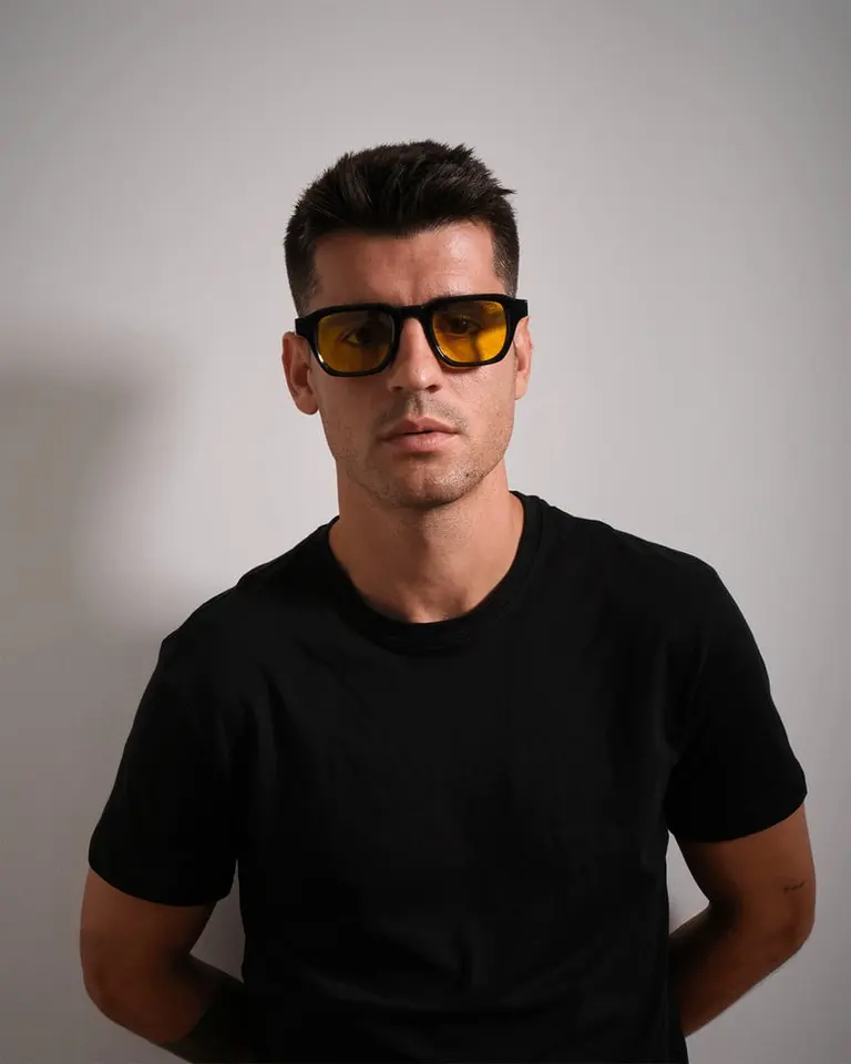 A front-facing portrait of Álvaro Morata wearing the Flowglasses Day Sync 03 blue light filtering glasses.
