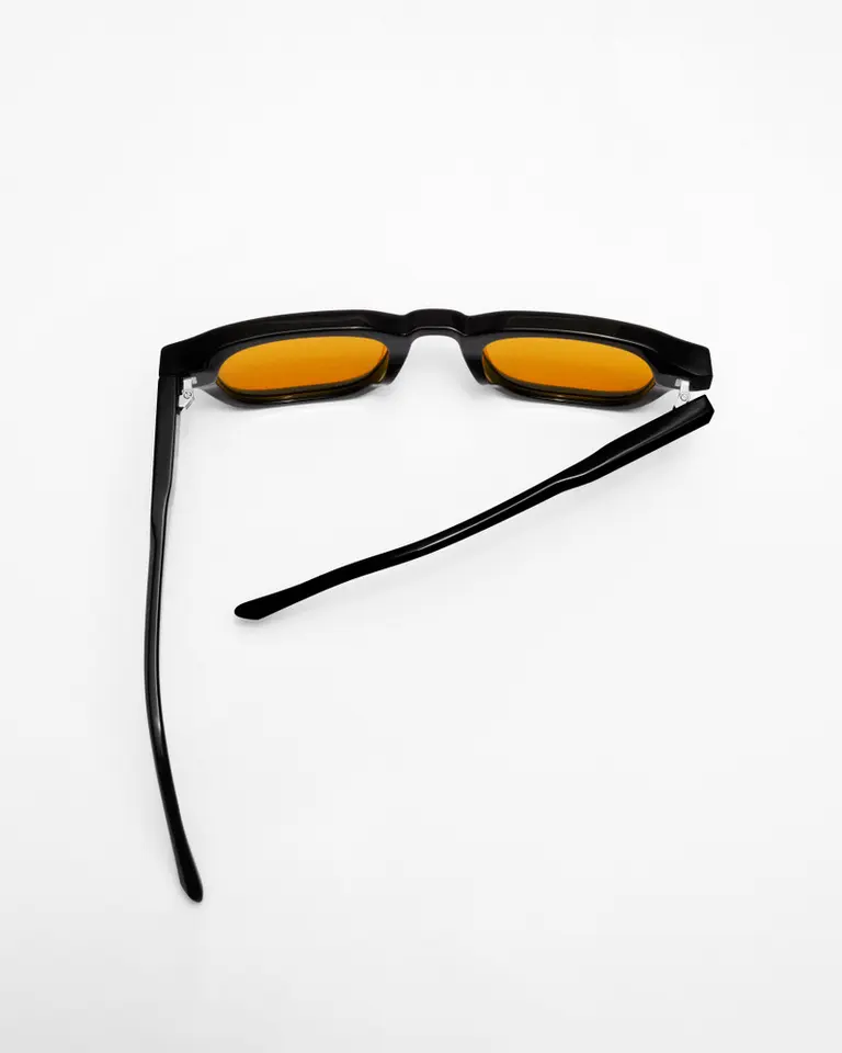 Flowglasses Day Sync 03 - Morata Edition shown in a top-down flat lay with black frames and amber lenses.
