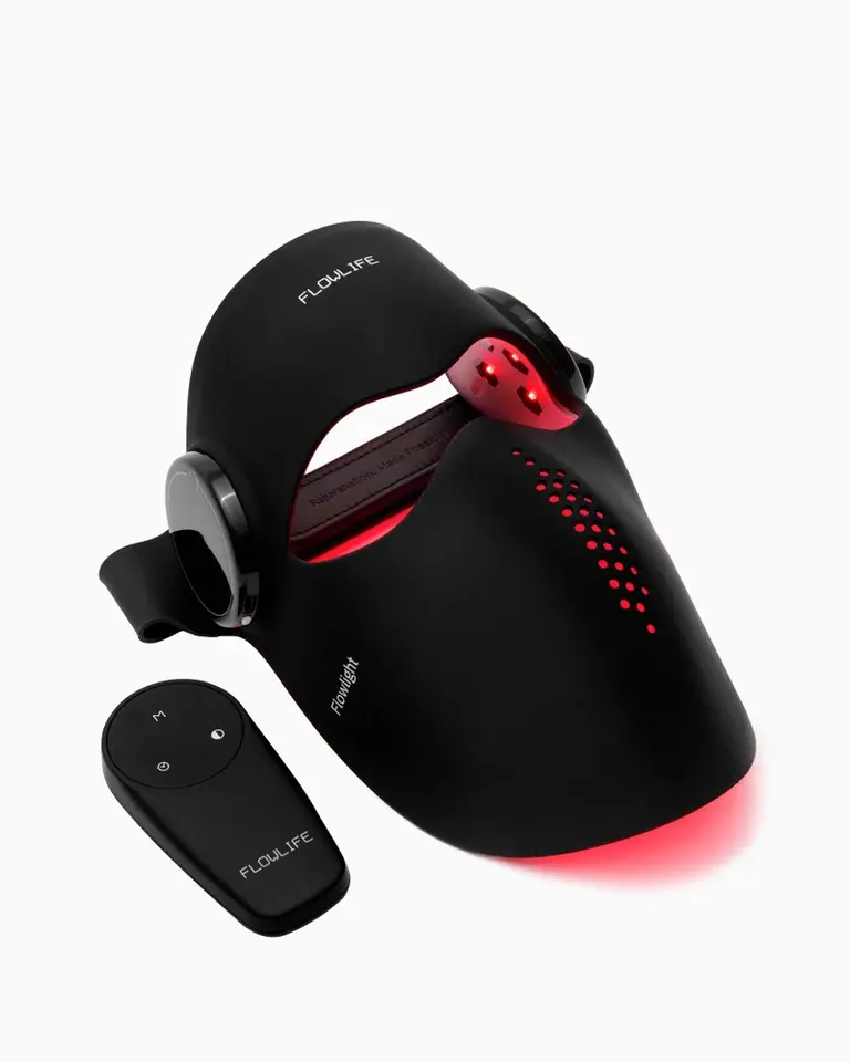 Flowlight LED Mask Pro Two Waves, a black silicone dual-wavelength LED mask with a red glow and wireless controller.