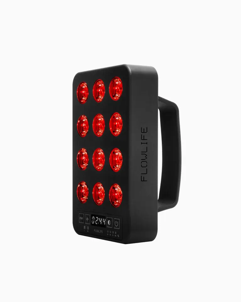 Portable black Flowlight Panel Go 60 Two Waves handheld unit with twelve illuminated red LEDs and a digital timer display.