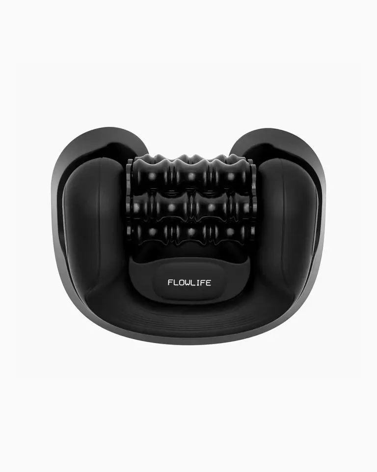 Black Flowlymph Roller Go shown securely placed in its floor-mounted stand for hands-free lymphatic drainage.
